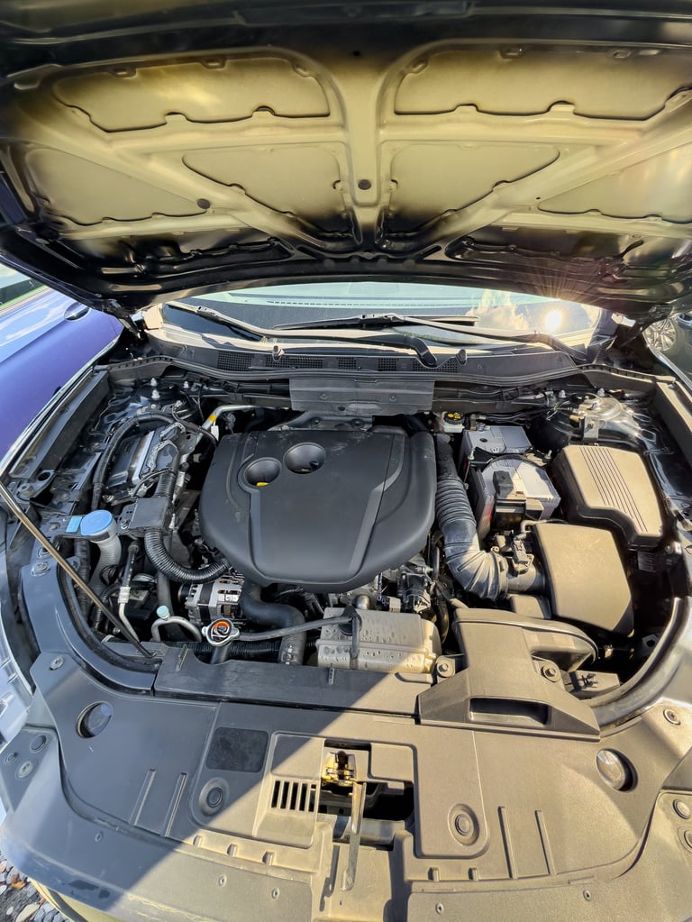 Clean engine bay detail showing modern car engine components