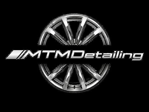 MTMDetailing logo featuring a polished silver alloy wheel on a black background