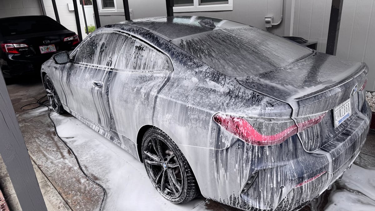 Silver sedan getting exterior reset detail foam wash by mobile detailing service in Tampa FL
